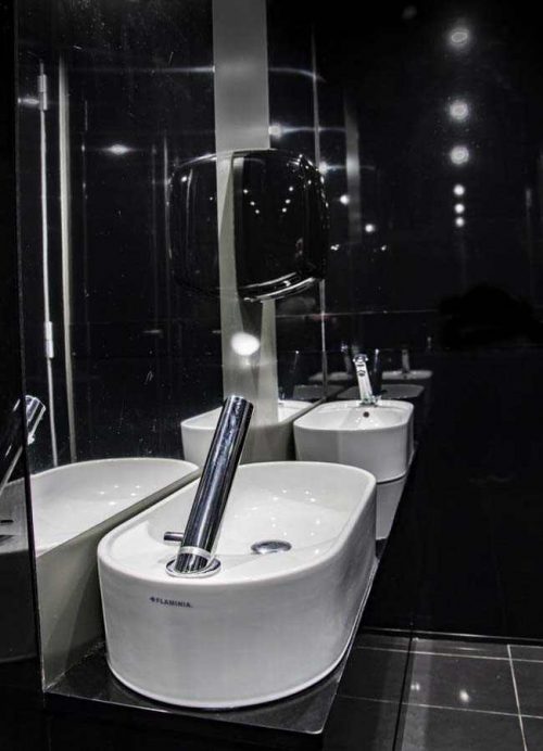 double anteroom sink with mirrors and soap dispenser